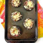 cookie sheet with low carb cheesesteak stuffed portobello mushrooms with text
