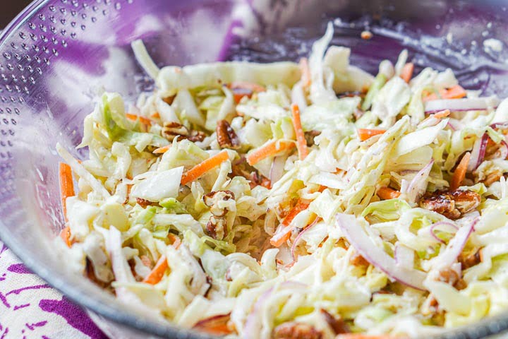 closeup of the bowl of keto coleslaw with pecans