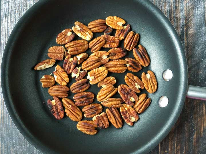 pan with whole roasted pecans