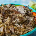 Slow cooker zesty garlic pulled pork is made with zesty limes and lots of garlic and is a delicious low carb and Paleo dish. Great  for tacos or sandwiches or can even be served as is.