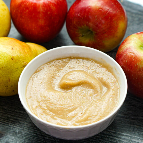 closeup of apple pear sauce made in the slow cooker with surrounds fruit