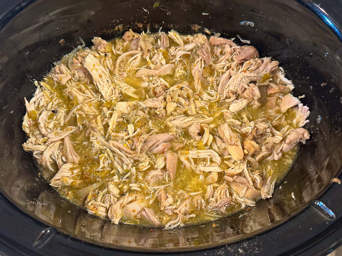 crockpot with finished shredded Mexican chicken