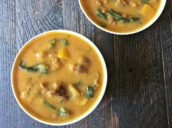 This delicious creamy pumpkin soup gets it's creaminess from a cauliflower puree and pumpkin. The sausage and kale make it a flavorA delicious healthy low carb comforting soup.