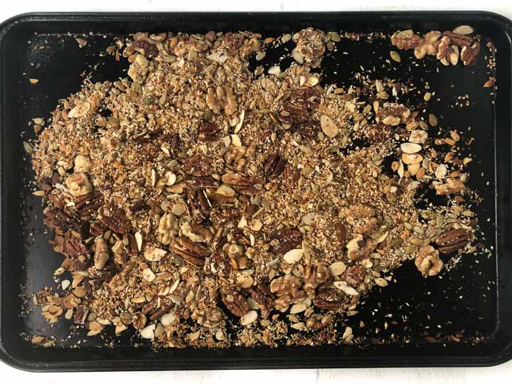 cookie sheet with baked nuts, seeds and coconut