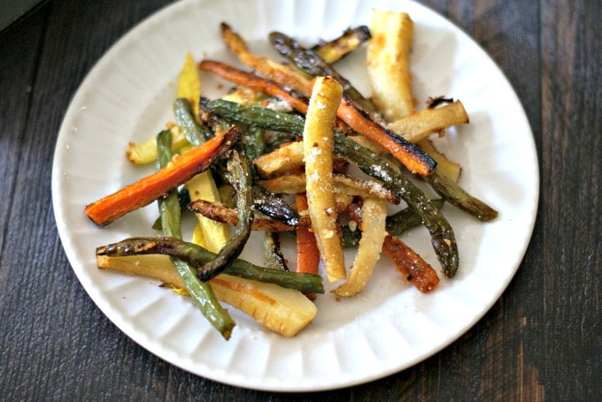 These Parmesan garlic veggie fries are a tasty side dish or snack and a healthy change from potatoes. Oven roasted and topped with salty cheese make these a delicious and healthy dish!