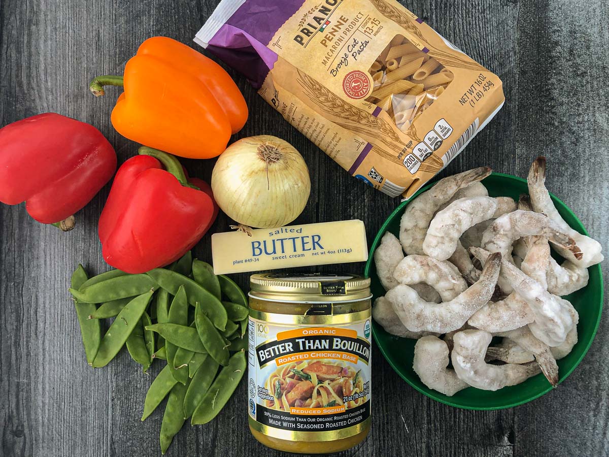 red pepper pasta ingredients - raw shrimp, pasta, peppers, onion, snow peas, butter, better than bouillon