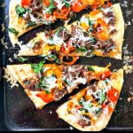 cookie sheet with asiago sausage & peppers easy flatbread with text overlay