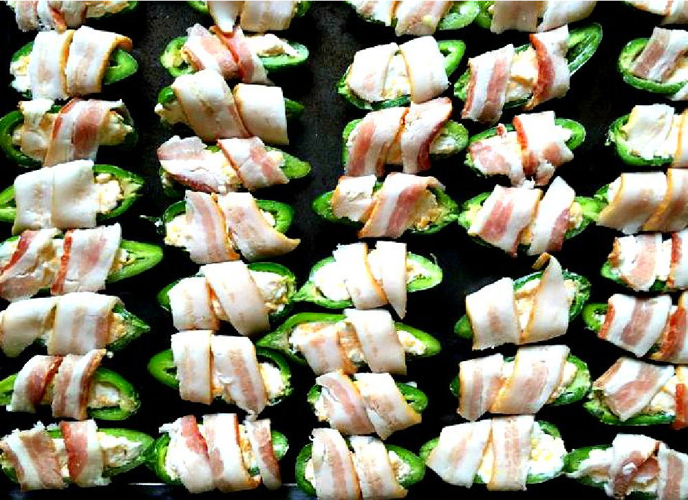 baking tray with bacon wrapped jalapenos ready to bake