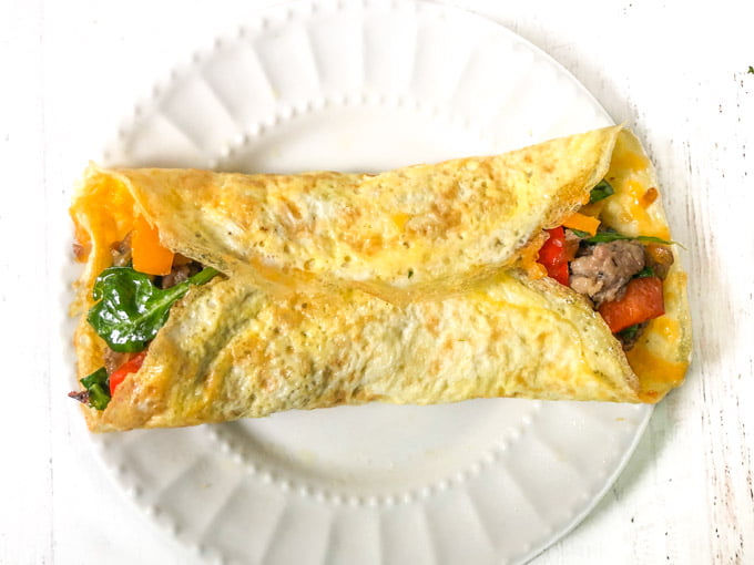 white plate with low carb breakfast burrito 