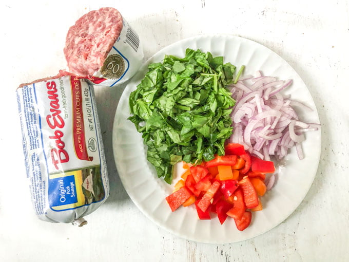 keto breakfast burrito ingredients of Bob Evans breakfast sausage, chopped spinach, chopped onions and chopped peppers