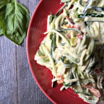 A creamy sauce of garlic, basil and sundered tomatoes with zucchini noodles (zoodles). Only takes minutes to make!