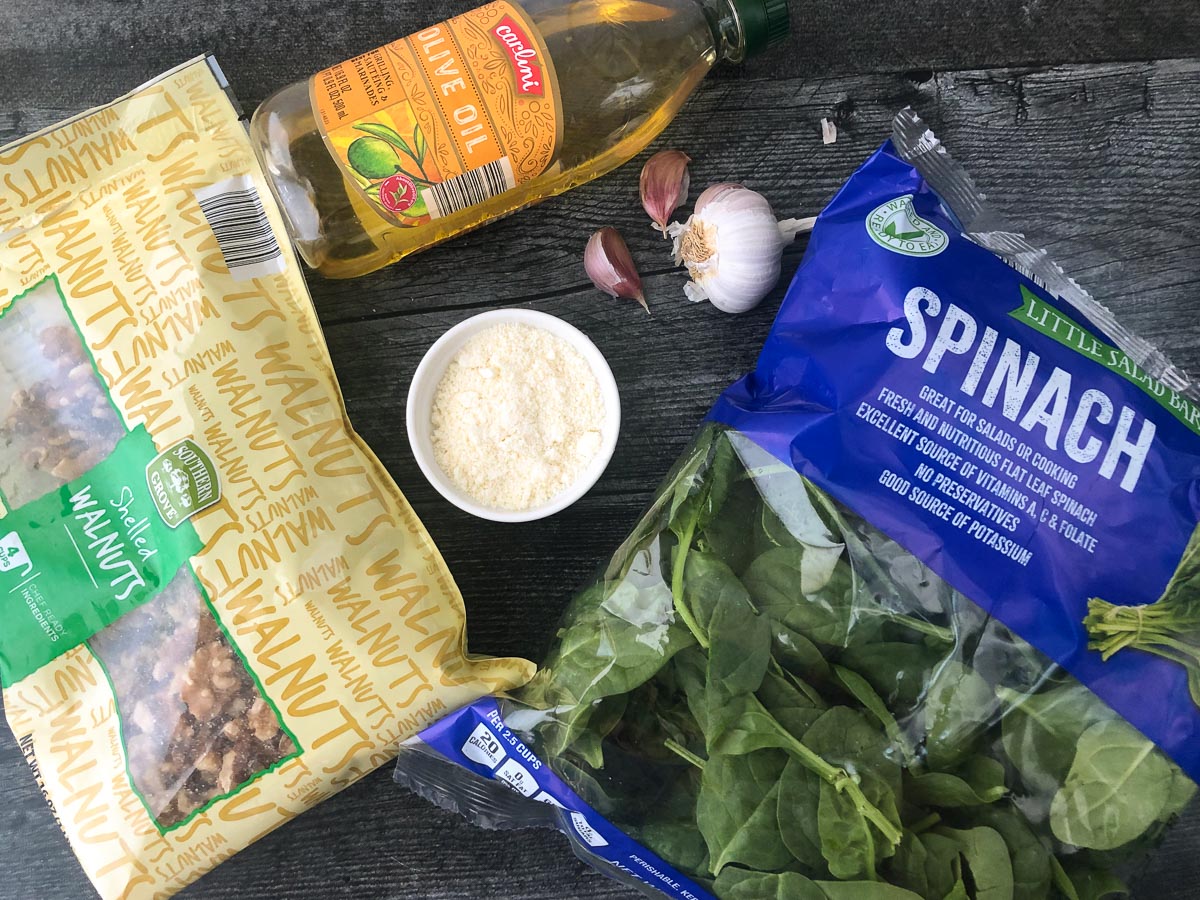 pesto ingredients - spinach, walnuts, garlic, olive oil and parmesan cheese