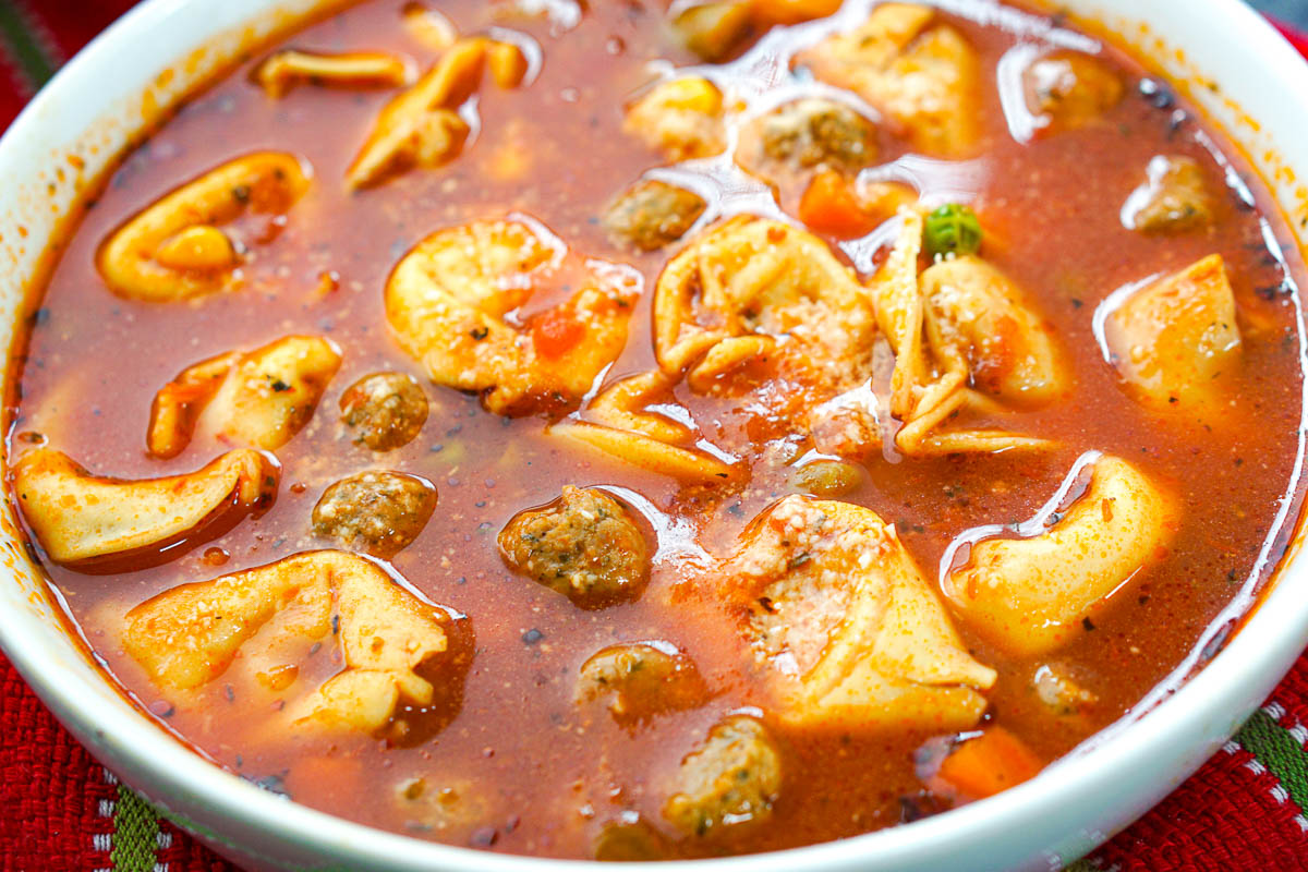 closeup of large white bowl with meatball soup