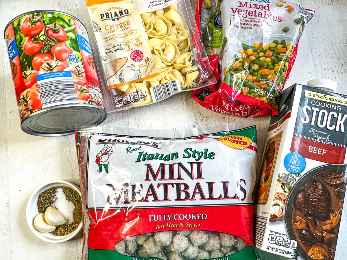 recipe ingredients - mini meatballs, crushed tomatoes, tortellini, frozen veggies, stock and spices