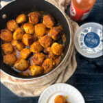 a pan and white plate with buffalo chicken meatballs and text