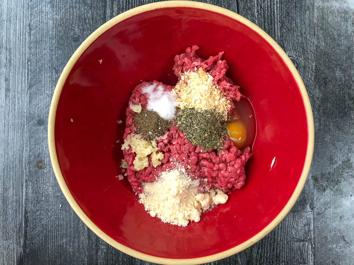red bowl with paleo meatball ingredients 