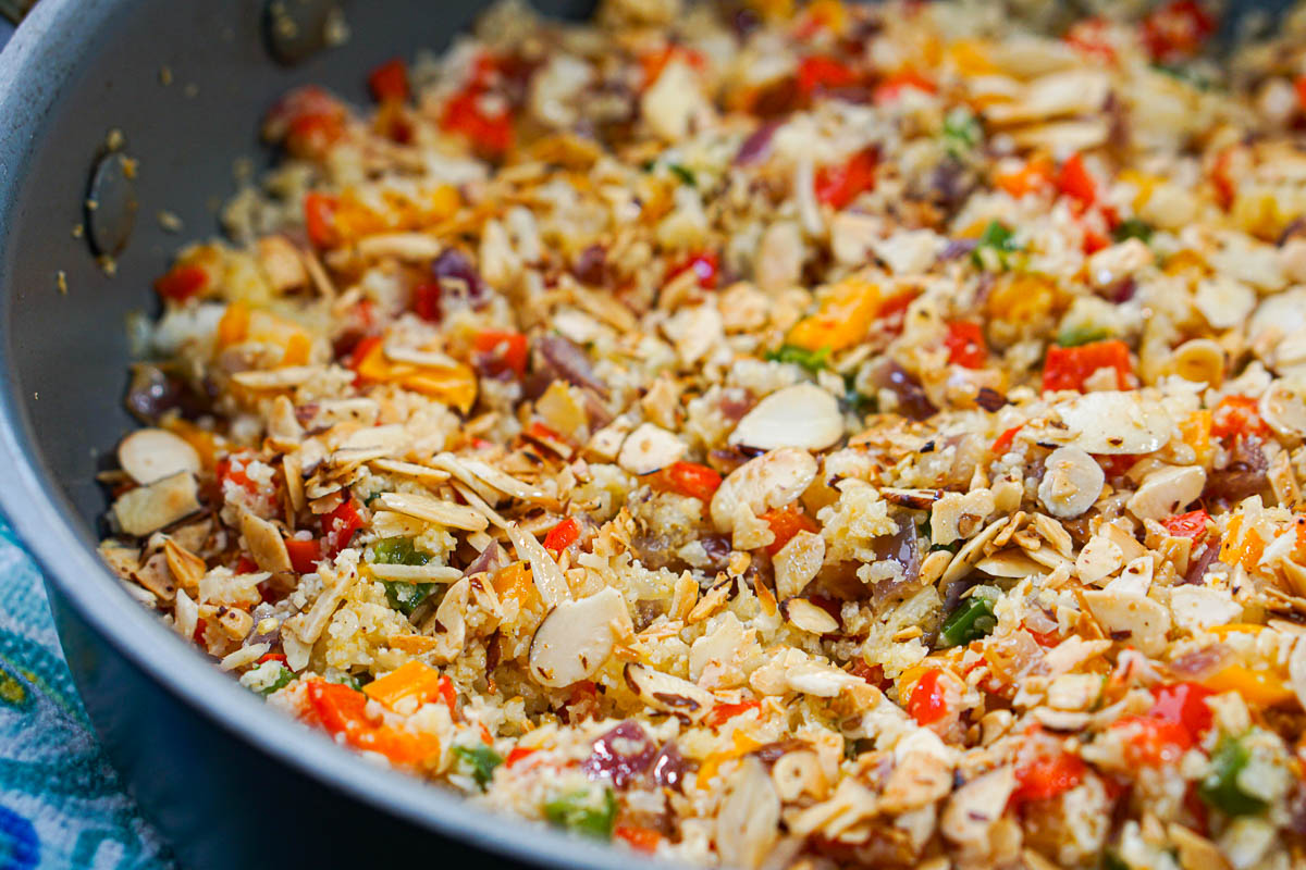 closeup of a pan of cauliflower rice pilaf with peppers