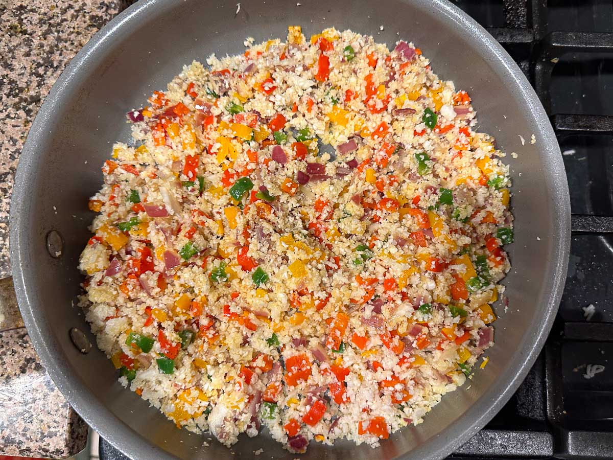 pan with sautéed cauliflower rice and veggies