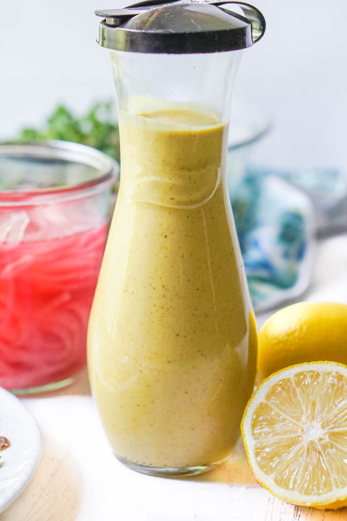 bottle of low carb dressing of lemon tahini