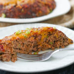 a white platter and dish with Keto Mexican meatloaf with text