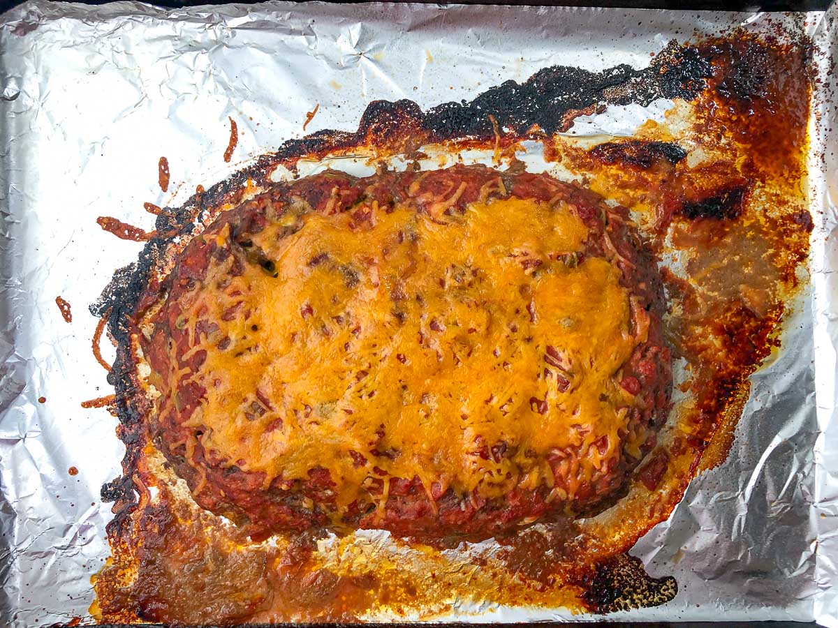 foil covered baking dish with finished mexican meatloaf