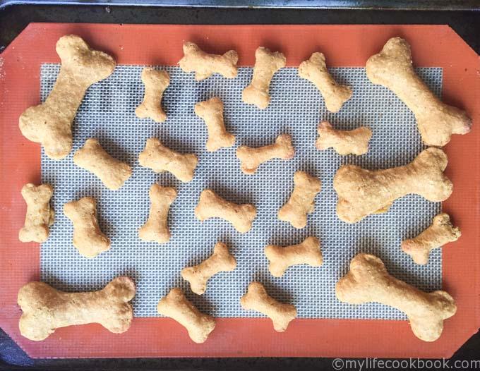 cooked dog biscuits on silicone mate in shape of dog bone