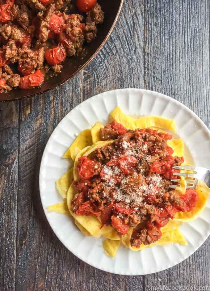 These low carb sausage and egg noodles are both fun and tasty. A delicious tomato and sausage sauce covers the noodles that are literally made from eggs.