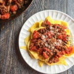 These low carb sausage and egg noodles are both fun and tasty. A delicious tomato and sausage sauce covers the noodles that are literally made from eggs.
