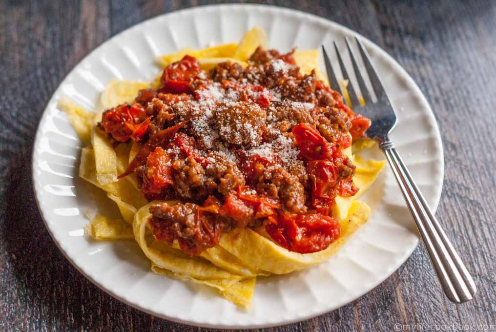 These low carb sausage and egg noodles are both fun and tasty. A delicious tomato and sausage sauce covers the noodles that are literally made from eggs.