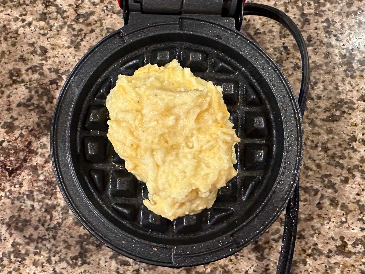waffle maker with raw batter in the center