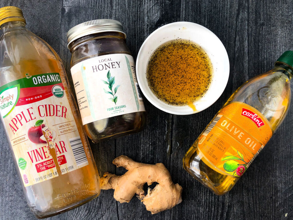 ingredients for vinaigrette - ginger, honey, olive oil, apple cider vinegar
