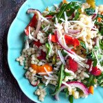 This arugula couscous salad is fresh, tasty and hearty. Perfect for a picnic, summer party or just eat it for lunch.