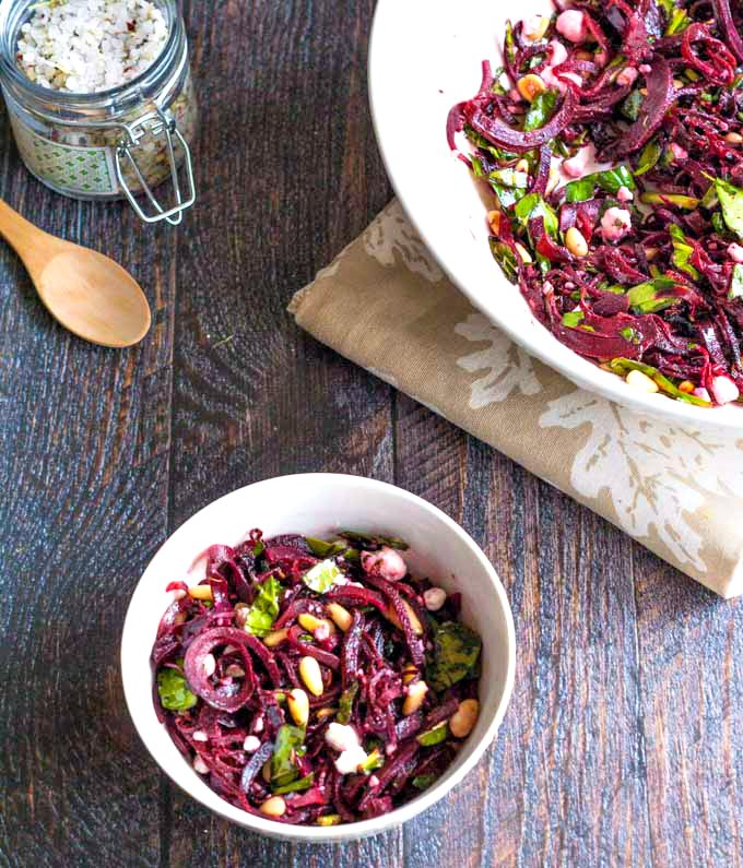 This beet noodles & goat cheese salad is a tasty change and perfect for spring. Using beet noodles, goat cheese and toasted pine nuts you get the perfect combination of tastes.