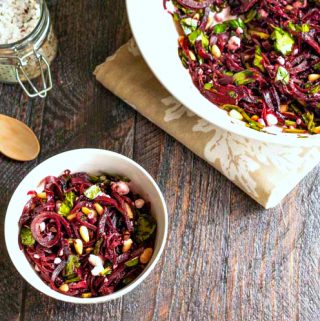 This beet noodles & goat cheese salad is a tasty change and perfect for spring. Using beet noodles, goat cheese and toasted pine nuts you get the perfect combination of tastes.