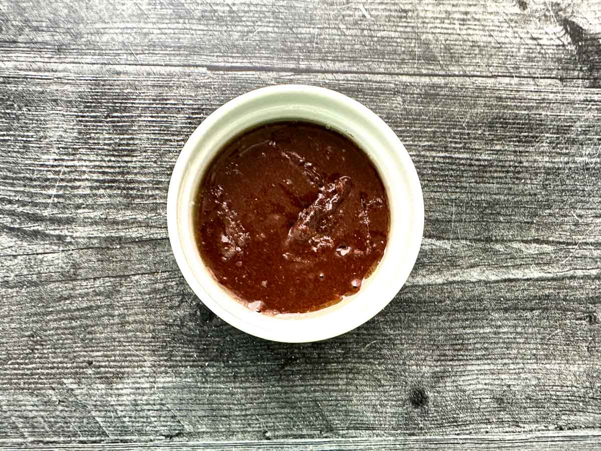 Aerial view of ramekin with keto chocolate cake ready to bake.