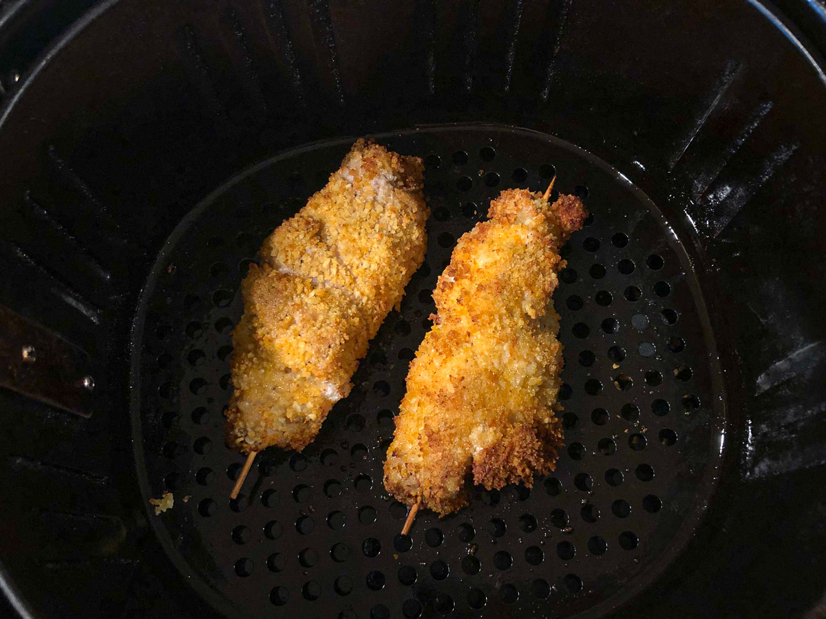 air fryer basket with 2 pieces of city chicken