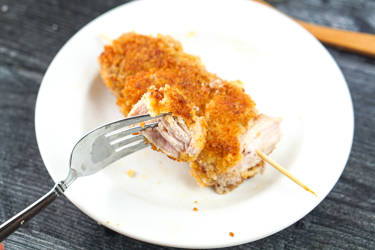 a forkful of a piece of city chicken