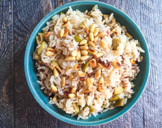 This olive & date rice is an easy and delicious side dish. Tangy green olives, sweet dates and toasted pine nuts make the perfect combination.