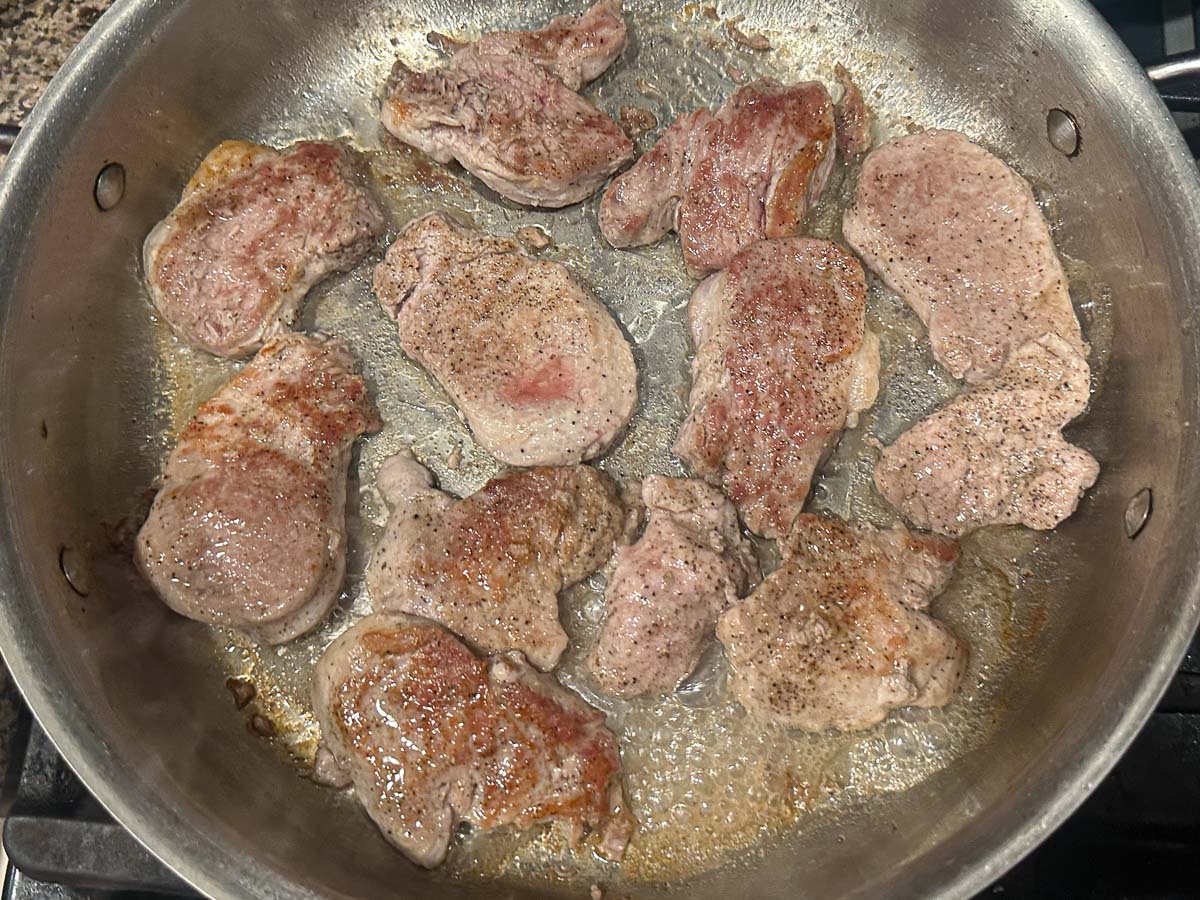 Pan with browned medallions.