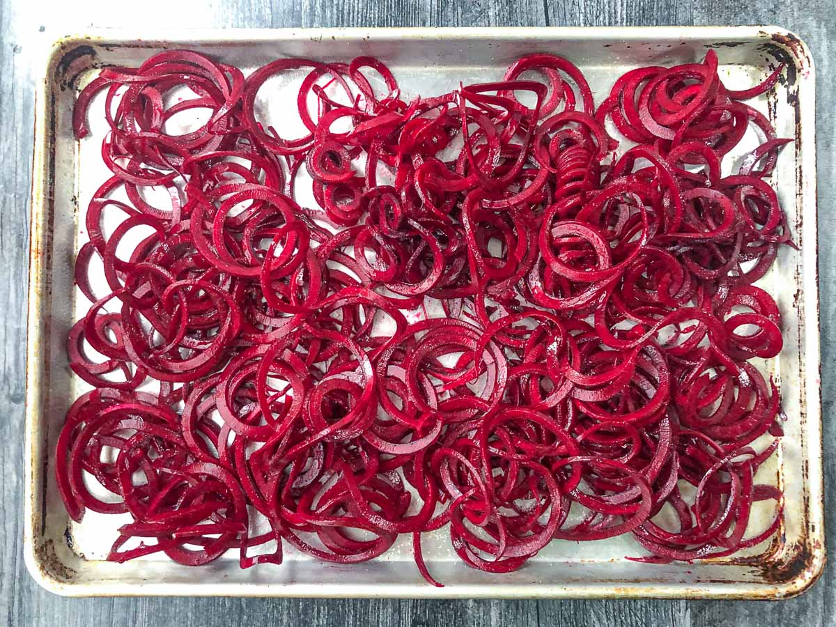 baking sheet with raw beet noodles about to be roasted
