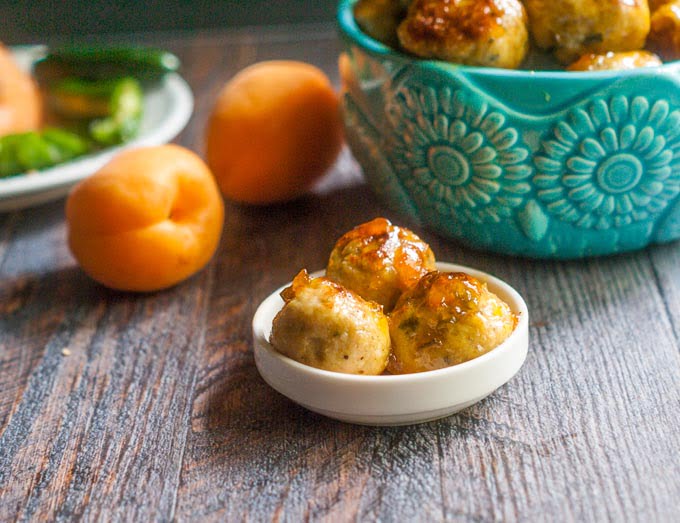 These spicy apricot chicken meatballs have the perfect balance of sweet and heat. They are easy to make and perfect for your next party. #SundaySupper