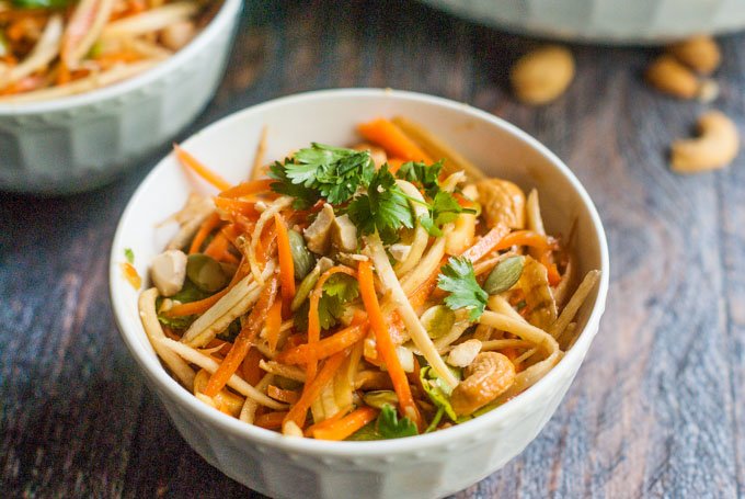 This crunchy Asian parsnip & carrot salad is fresh and tasty and you can make it in minutes. Lots of crunch from veggies, seeds and nuts tossed in an Asian dressing.
