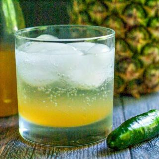 This pineapple jalapeño shrub cocktail has the sweetness of pineapple, the tang of vinegar and the heat of jalapeños. Great with seltzer or vodka for a refreshing summer drink.
