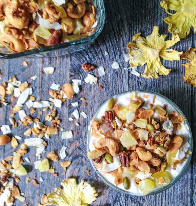 This pina colada granola is the perfect snack to celebrate National Pina Colada Day! A tasty mixture of nuts, seeds, coconut, pineapple and coconut sugar make for a tasty grain free tropical treat. #SundaySupper