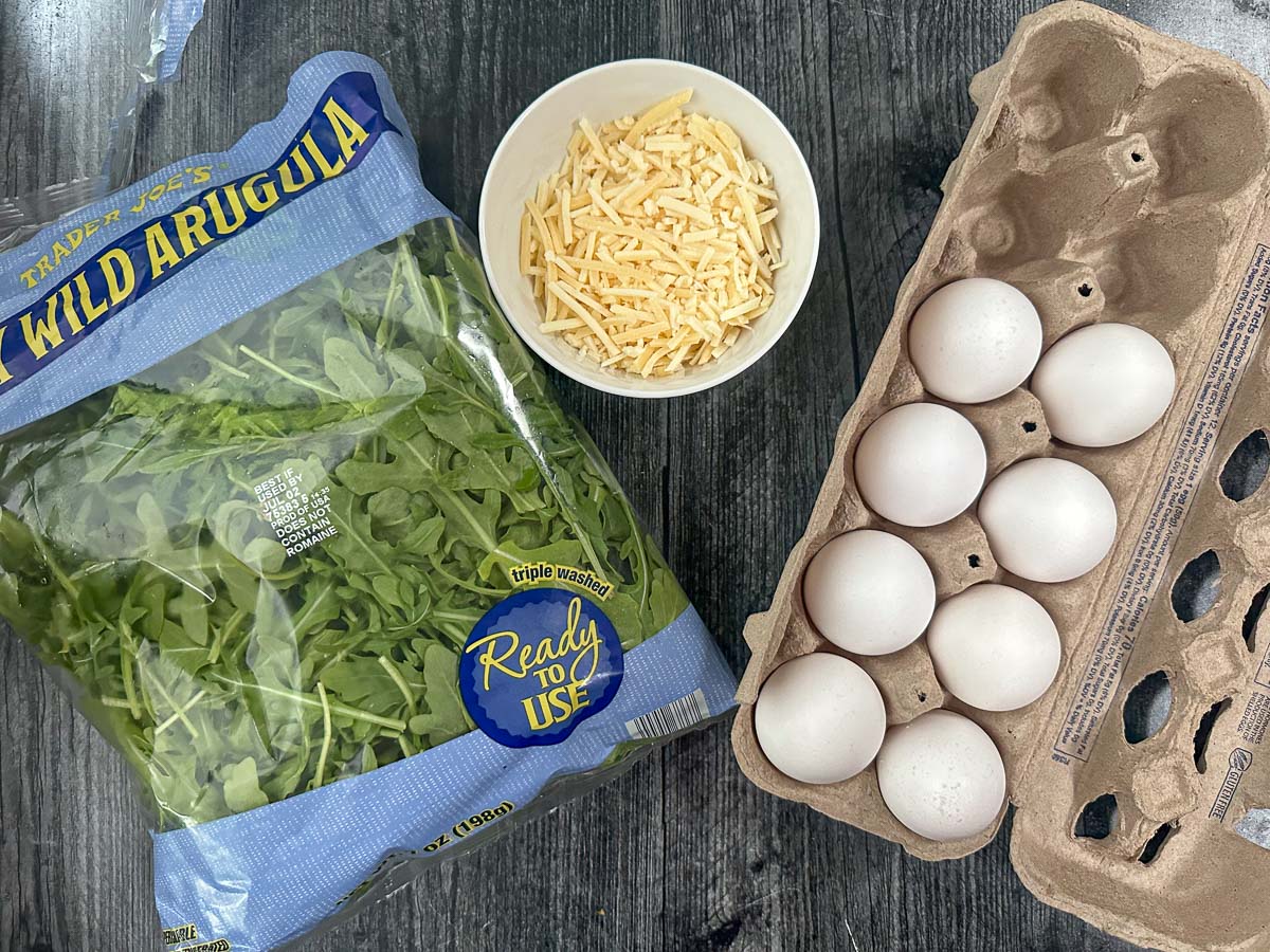 recipe ingredients - eggs, arugula and asiago cheese