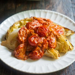 This roasted cabbage with creamy tomato sauce reminds me of a decadent pasta dish. The flavorful tomato sauce tops the sweet roasted cabbage for a great vegetarian meal.