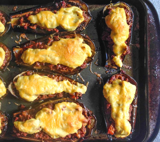 This stuffed eggplant with cauliflower cream sauce is a gluten free take on moussaka. Eggplant stuffed with seasoned meat and topped with a creamy cauliflower cheese sauce.