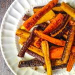 These colorful curried carrots are seasoned and roasted for maximum flavor. Spicy and cheesy, they make for the perfect side dish this fall.