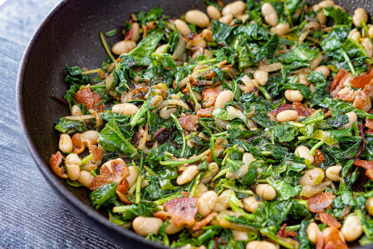closeup of a pan of beans and greens
