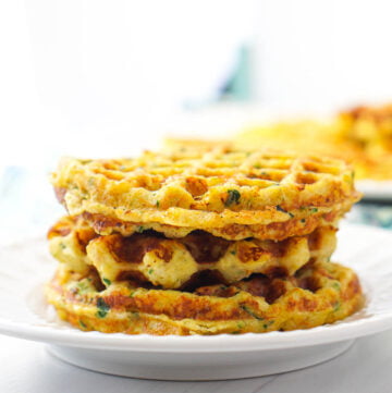 stack of keto vegetable waffles on white plate
